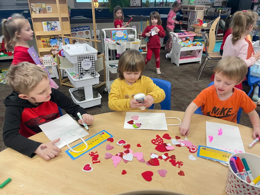 Children at Vitctory Elementary School make Valentine's Day crafts.
